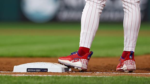 View of Bryce Harper's cleats as he stands on first base.